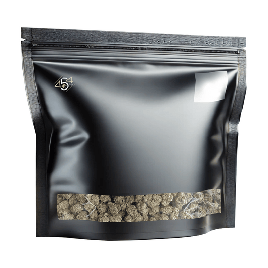 Black mylar bag with cannabis truffles on a white background