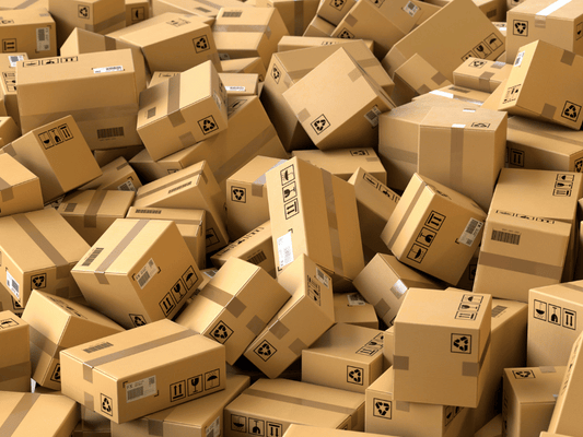 Stacks of cardboard boxes, symbolizing secure packaging for cannabis storage and shipping to ensure product quality and safety during transit.