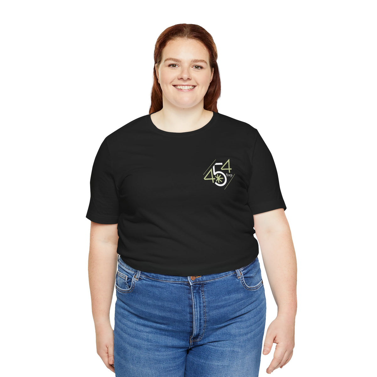 Woman wearing black 454 Bags logo T-shirt tucked into jeans
