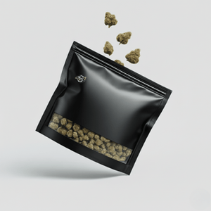 Black plastic bag with cannabis buds on a light gray background