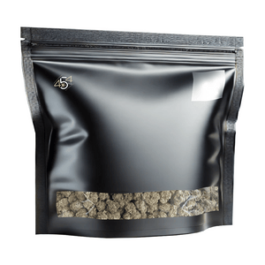 Black mylar bag with cannabis truffles on a white background