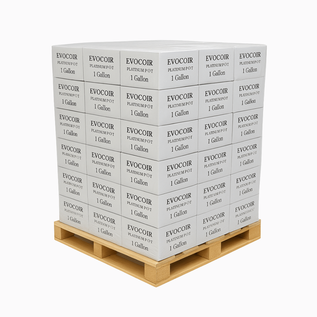 Stack of EVOCOIR product boxes on a wooden pallet against a white background