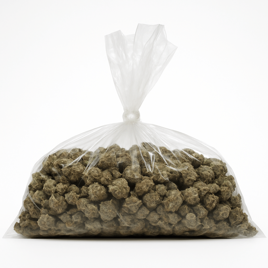 Clear plastic bag filled with greenish-brown pellets on a white background