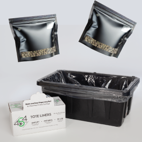 Black plastic containers and bags with a box labeled 'Tote Liners' on a white background