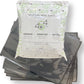 Packaging and samples of 454 Vacuum Bags, 15"x20" in size, formulated specially for cannabis storage. One side is clear, revealing the cannabis inside, and the other side is solid black.